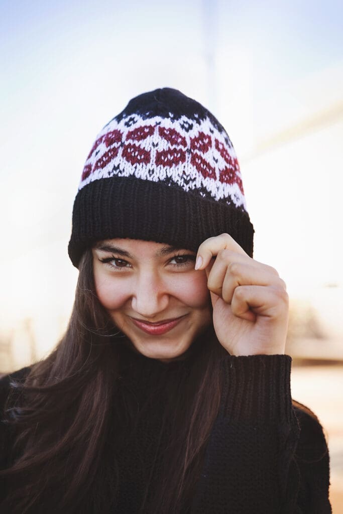 Girl wearing Crosspoint Beanie for Free Knitting Pattern