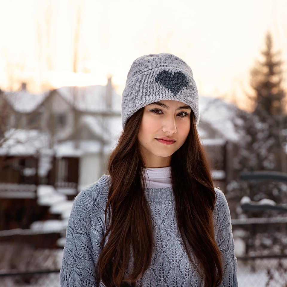 Simple Double Brim Beanie using duplicate stitch knitting on girl 